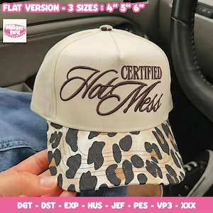 May include: A cream-coloured baseball cap with brown embroidered script reading "Certified Hot Mess" on the front panel. The brim features a black and tan leopard print pattern. The text "FLAT VERSION - 3 SIZES : 4" 5" 6"" is visible at the top.