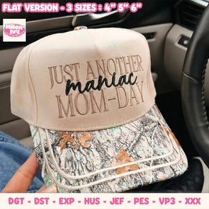 May include: A beige baseball cap with a camouflage brim featuring the embroidered text JUST ANOTHER maniac MOM-DAY. The cap includes text indicating flat version sizes of 4, 5, and 6 inches, along with a list of file formats DGT, DST, EXP, HUS, JEF, PES, VP3, and XXX.