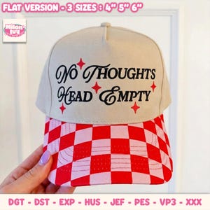 May include: A beige baseball cap with a red and pink checkered brim. The front panel features black embroidered text that reads "NO THOUGHTS HEAD EMPTY" surrounded by small red four-pointed star icons. The text "FLAT VERSION - 3 SIZES : 4" 5" 6"" appears above.