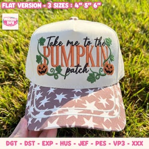 May include: A cream-coloured baseball cap featuring the embroidered text Take me to the PUMPKIN patch in black and orange. The design includes two small orange jack-o'-lanterns and green vines. The brim has a brown and white star pattern.