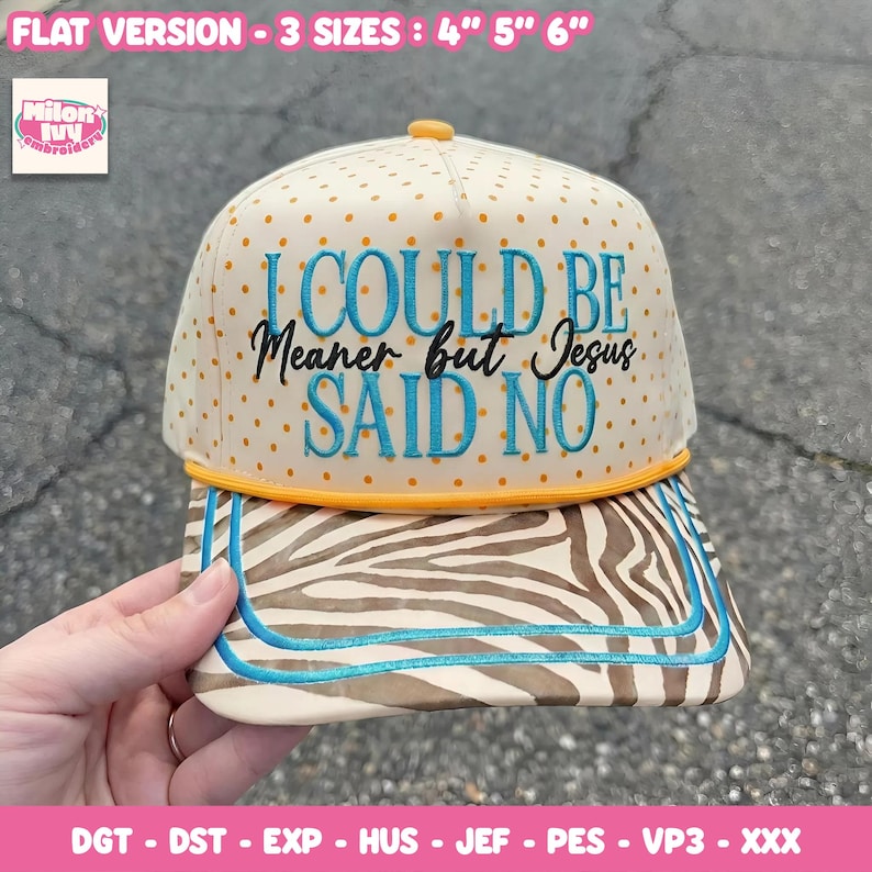 May include: A beige baseball cap with orange polka dots and the text "I COULD BE Meaner but Jesus SAID NO" embroidered in blue and black. The brim features a zebra print design with blue trim. The cap is available in 4", 5", and 6" sizes.