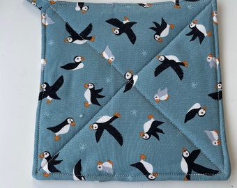 Cute and playful Puffins cotton heat reflective pot holder