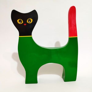 Green paper mache cat, folder and recycled paper