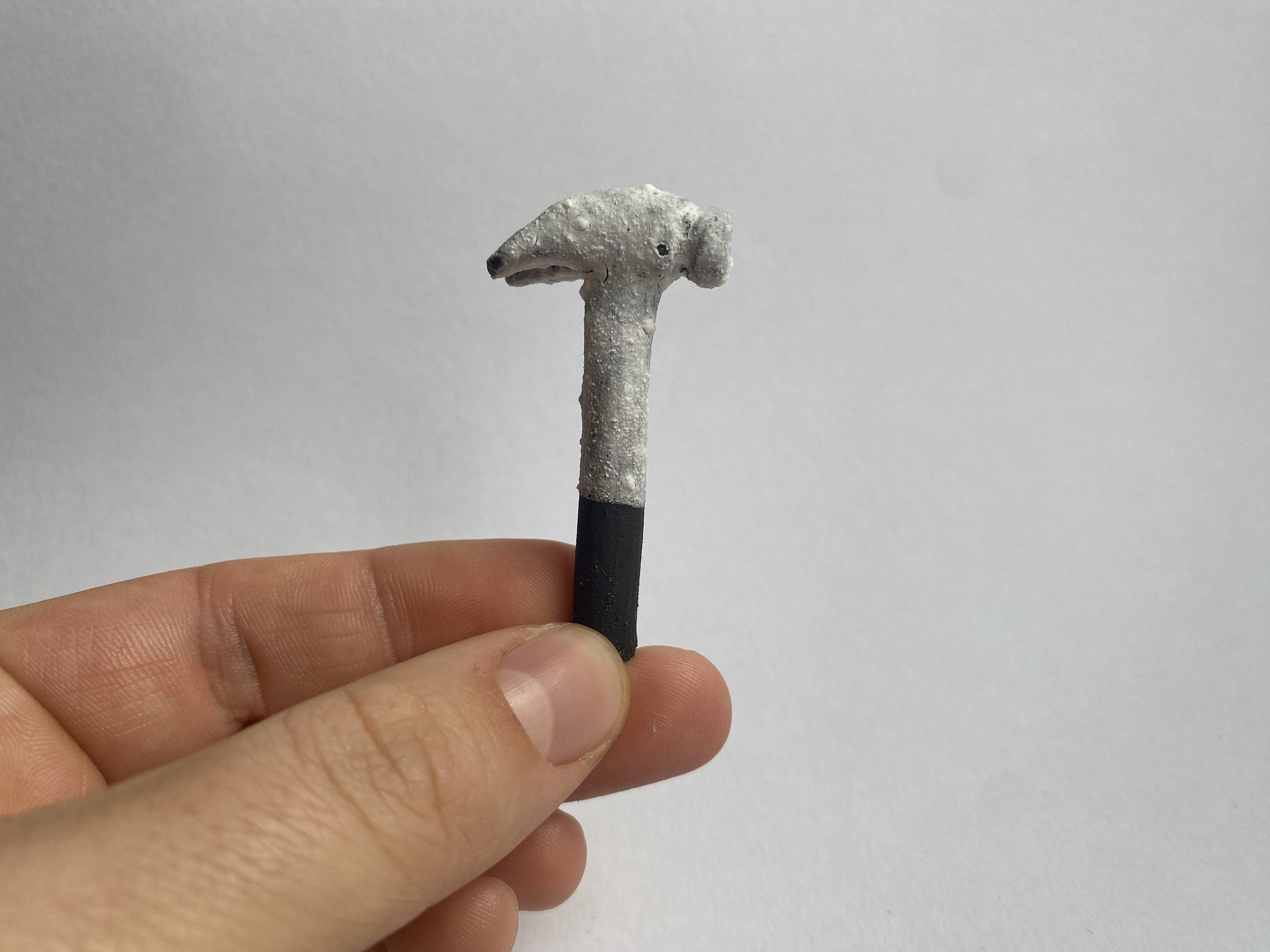 Tiny Hammer, Black clay and porcelain slip