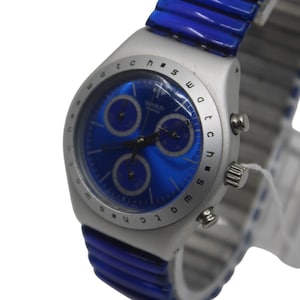 May include: A silver Swatch watch with a blue face and a blue silicone band. The watch has a chronograph function and the words "Swatch watch" are printed on the face.