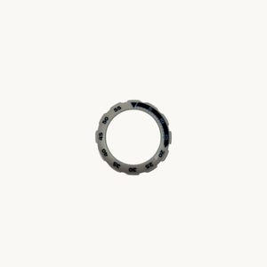 May include: A circular, light gray timer bezel with black numerals and markings. The bezel has a black triangle indicator and numbers from 5 to 55. The numbers are in increments of 5. The bezel is set against a white background.