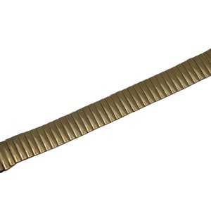 May include: A gold-toned metal watch strap with a textured surface.