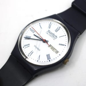 1983, Swatch MUY antiguo, caballero, GN701, muy buen estado pero usado, funciona con correa original, LEER descripción