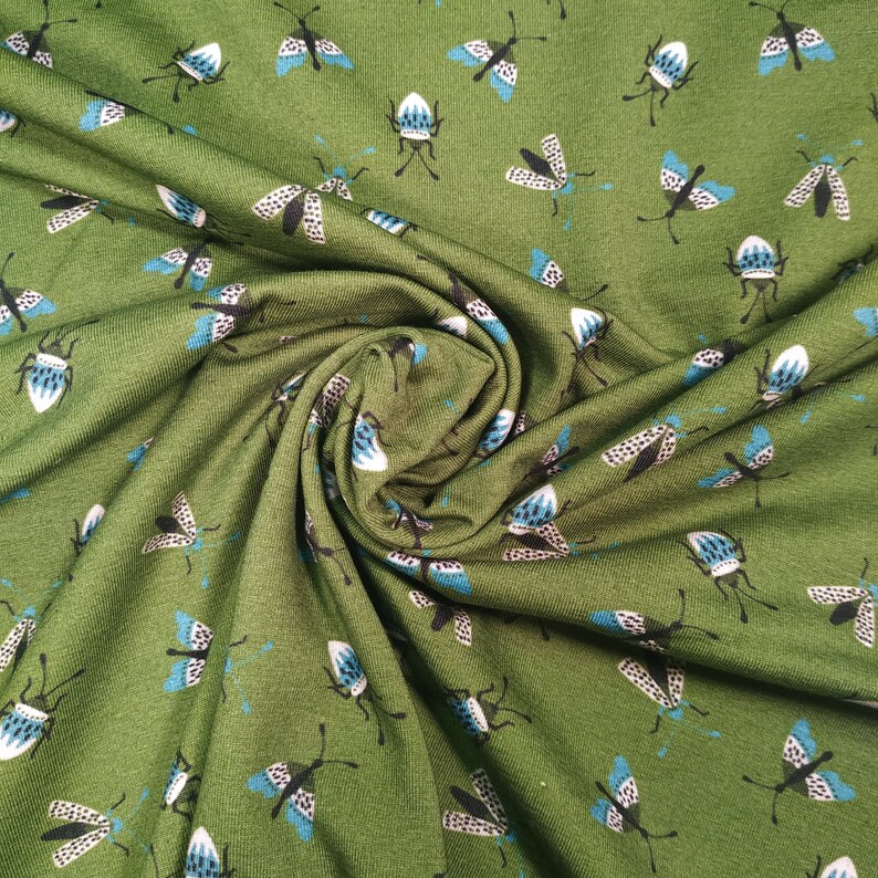 Fabbies T-shirt fabric with insects on a green background