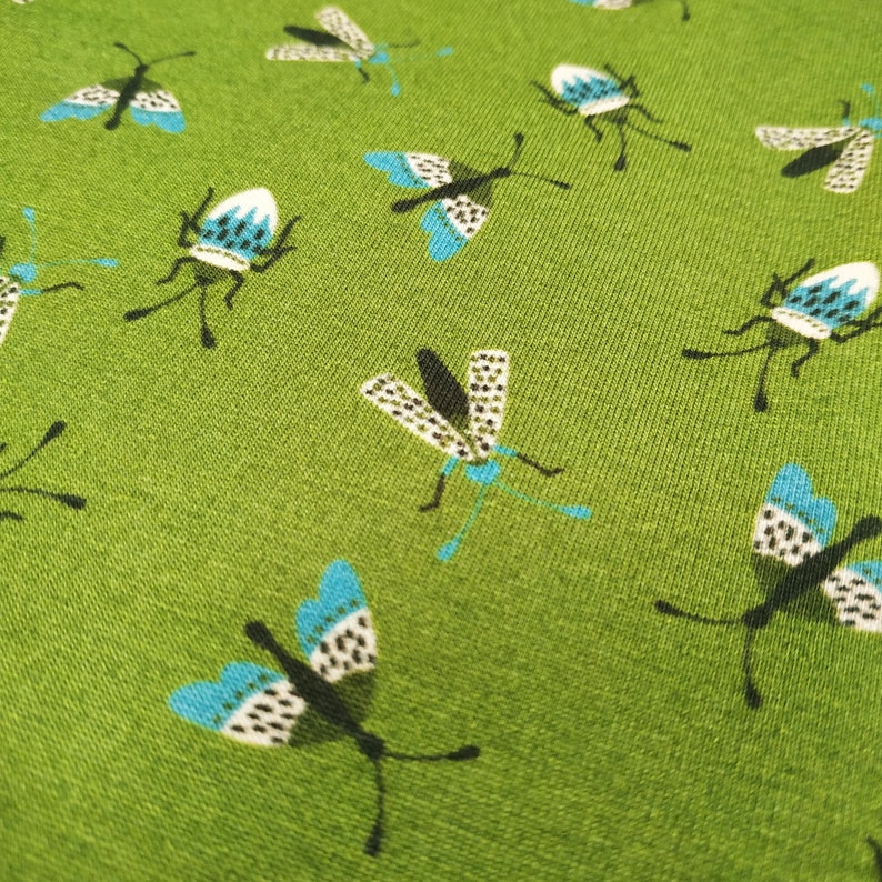 Fabbies T-shirt fabric with insects on a green background