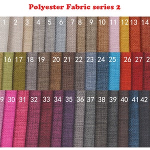May include: A swatch card of 43 different polyester fabrics. The fabrics are arranged in rows of 15, with numbers 1 through 43 labeling each fabric sample.