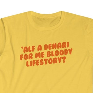 May include: Yellow t-shirt with the text "'Alf a Denari for me bloody lifestory?"