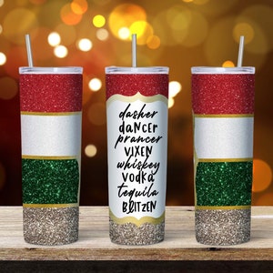 May include: Three red, white, and green glitter tumbler cups with straws. The middle cup has the text "dasher dancer prancer vixen whiskey vodka tequila blitzen" on it.