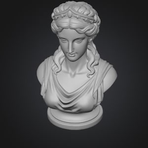 May include: A gray bust of a woman with curly hair, a crown, and a draped garment. The sculpture is set against a dark gray background. The bust is a classical art piece.