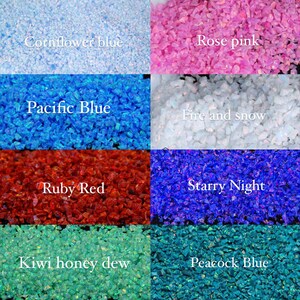 May include: A collection of crushed opal in various colors, including cornflower blue, rose pink, pacific blue, fire and snow, ruby red, starry night, kiwi honey dew, and peacock blue. Each color is labeled with its name in white text.