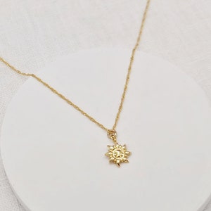 gold-plated chain with sun pendant