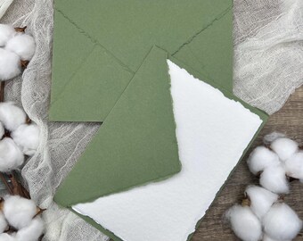 May include: A set of two green envelopes with a white card inside. The envelopes and card have a textured, handmade paper look.