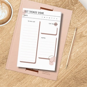 May include: A white printable to-do list with a brown border. The printable has sections for a date, a to-do list, top priority, notes, and days of the week. The text "GET THINGS DONE" is at the top of the printable.