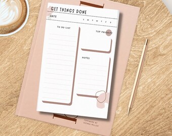 May include: A white printable to-do list with a brown border. The printable has sections for a date, a to-do list, top priority, notes, and days of the week. The text "GET THINGS DONE" is at the top of the printable.