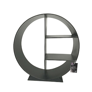 May include: A black, circular wall shelf with three interior shelves. The shelf has a unique design, with a large, open circle forming the outer frame. The shelves are rectangular and provide storage space. The shelf is made of metal and has a matte finish.