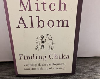 Finding Chika: A Little Girl, an Earthquake, and the Making of a Family Hardcover – Deckle Edge, November 5, 2019 by Mitch Albom NEW BOOK