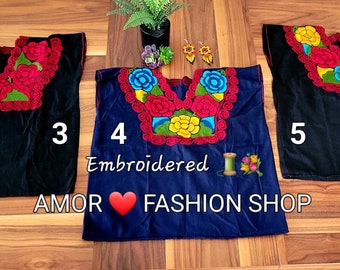May include: Three embroidered tops with floral designs. The tops are black, navy blue, and black. The text "AMOR FASHION SHOP" and "Embroidered" are visible on the image.