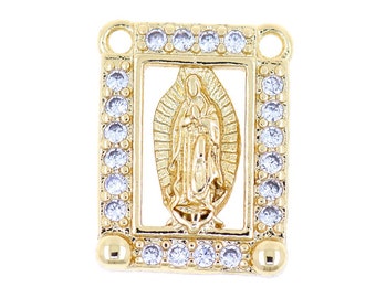 May include: Gold-toned pendant featuring a depiction of the Virgin Mary within a square frame adorned with clear cubic zirconia stones.