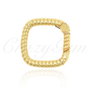 May include: A gold square ring with a twisted rope design.