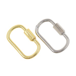 May include: Two oval-shaped screw lock carabiners. One is gold-colored, and the other is silver-colored. The carabiners have a rectangular screw lock mechanism.