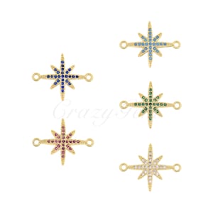 May include: Four gold-toned starburst connector charms with different colored crystal accents. The charms have two jump rings for attaching to jewelry.