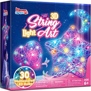 May include: A Klever Kits Make Your 3D String Light Art box featuring a star, heart, and crescent moon design. The packaging displays colorful string-wrapped shapes illuminated by 30 multicolored LED bulbs and includes feathers for decoration.