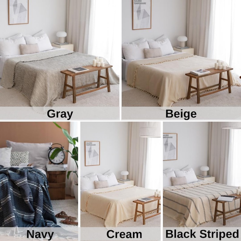 May include: A set of four throw blankets in different colors and patterns. The blankets are shown draped over beds in a minimalist bedroom setting. The colors are gray, beige, navy blue with white stripes, and cream with white pom-poms.