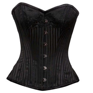 May include: Black corset with vertical stripes and a floral pattern on the upper bust. The corset has a sweetheart neckline and is fastened with silver-colored buttons. A classic piece of lingerie.