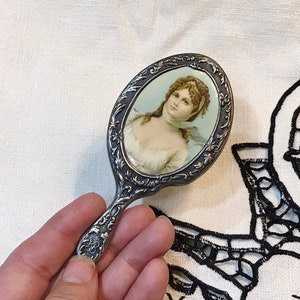 ANTiQUE Mini HAND MIRROR, SiLverPlate PurSe Mirror, stamped BB on HandLe, Celluloid ViCTorian Lady PorTraiT on back, Repousse SiLveR, 4"