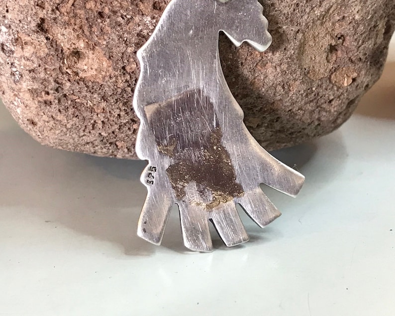 This vintage HOPI STERLiNg OVERLAY KaCHiNa PENDANT is BEAUTIFULLY MADE!  Nice deep cuts and a stylized modern design make this a very unique pendant.  It's unsigned but  the unusual tiny feathery design on the bottom that looks like tiny combs, can be seen in the work of Sparks Masawytewa.  It's in great condition and has a generous bale on the back.   It's 2-1/8"  and would make a lovely gift for someone who loves Native American Jewelry.