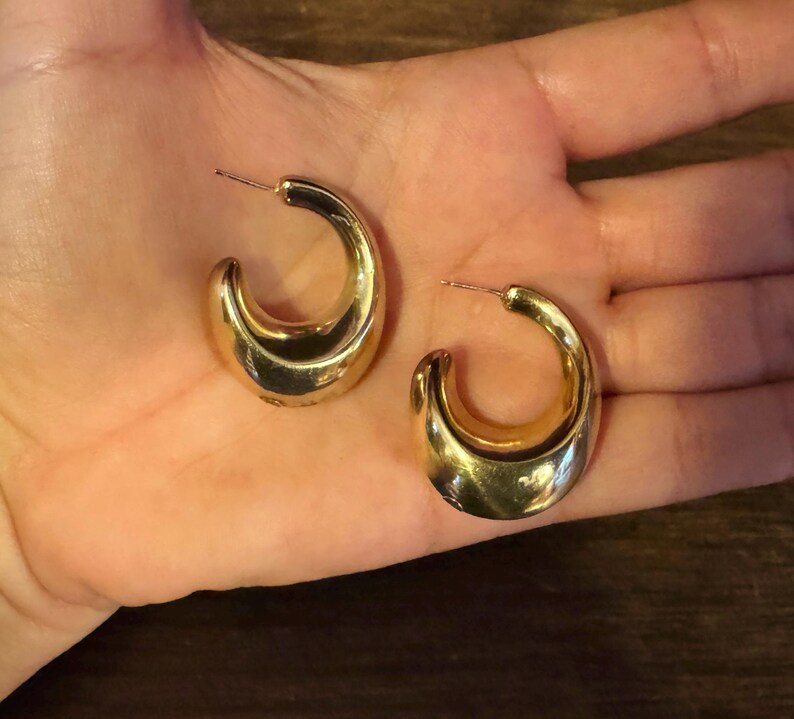 These vintage HALF HOOP EARRiNGS are FABULOUS!  They're gold vermeil over sterling.  The shape is a half hoop or crescent.  They're carinated and puffy or 3-d.  They're lightweight and wear beautifully.  I've left the original patina or tarnish.