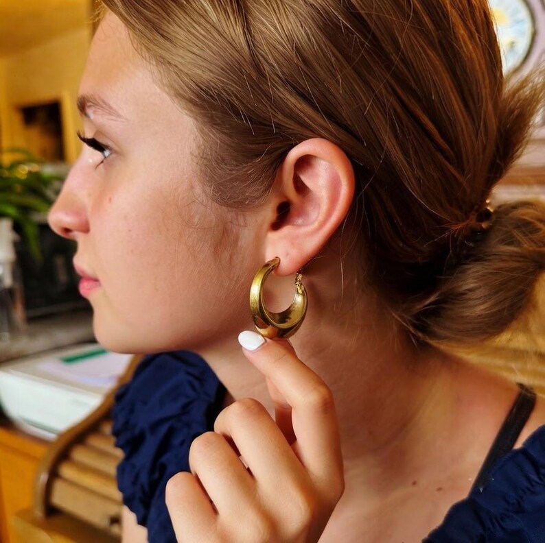 These vintage HALF HOOP EARRiNGS are FABULOUS!  They're gold vermeil over sterling.  The shape is a half hoop or crescent.  They're carinated and puffy or 3-d.  They're lightweight and wear beautifully.  I've left the original patina or tarnish.
