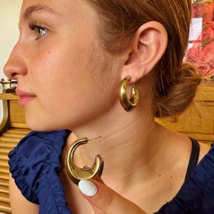 These vintage HALF HOOP EARRiNGS are FABULOUS!  They're gold vermeil over sterling.  The shape is a half hoop or crescent.  They're carinated and puffy or 3-d.  They're lightweight and wear beautifully.  I've left the original patina or tarnish.