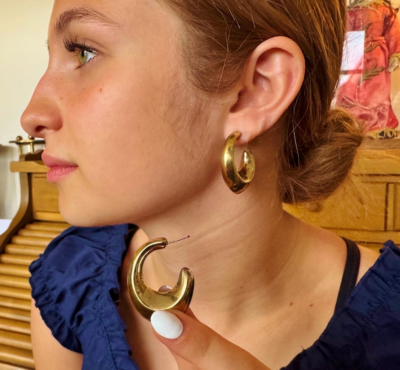 These vintage HALF HOOP EARRiNGS are FABULOUS!  They're gold vermeil over sterling.  The shape is a half hoop or crescent.  They're carinated and puffy or 3-d.  They're lightweight and wear beautifully.  I've left the original patina or tarnish.