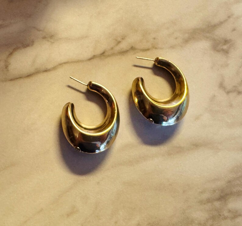 These vintage HALF HOOP EARRiNGS are FABULOUS!  They're gold vermeil over sterling.  The shape is a half hoop or crescent.  They're carinated and puffy or 3-d.  They're lightweight and wear beautifully.  I've left the original patina or tarnish.