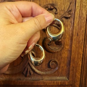 These vintage HALF HOOP EARRiNGS are FABULOUS!  They're gold vermeil over sterling.  The shape is a half hoop or crescent.  They're carinated and puffy or 3-d.  They're lightweight and wear beautifully.  I've left the original patina or tarnish.