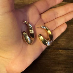 These vintage HALF HOOP EARRiNGS are FABULOUS!  They're gold vermeil over sterling.  The shape is a half hoop or crescent.  They're carinated and puffy or 3-d.  They're lightweight and wear beautifully.  I've left the original patina or tarnish.