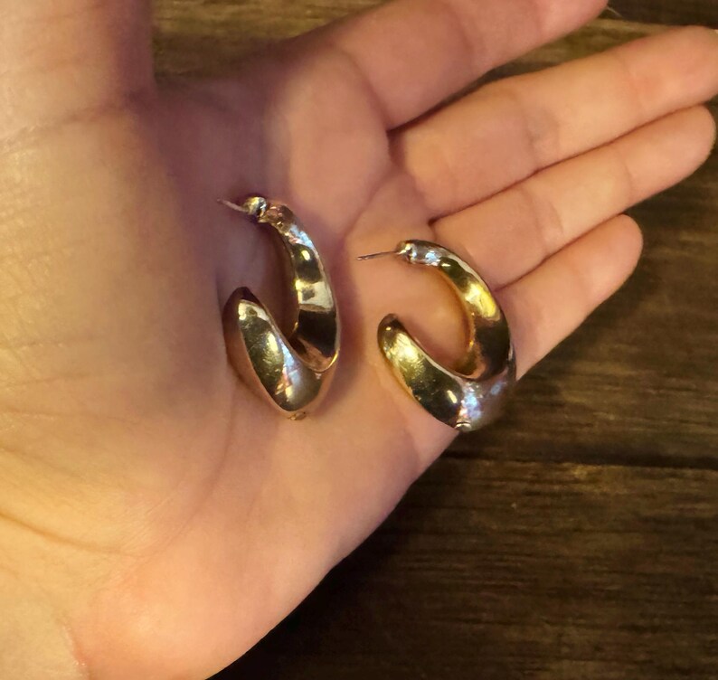 These vintage HALF HOOP EARRiNGS are FABULOUS!  They're gold vermeil over sterling.  The shape is a half hoop or crescent.  They're carinated and puffy or 3-d.  They're lightweight and wear beautifully.  I've left the original patina or tarnish.
