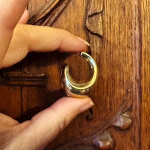 These vintage HALF HOOP EARRiNGS are FABULOUS!  They're gold vermeil over sterling.  The shape is a half hoop or crescent.  They're carinated and puffy or 3-d.  They're lightweight and wear beautifully.  I've left the original patina or tarnish.