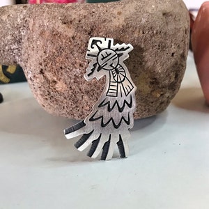 This vintage HOPI STERLiNg OVERLAY KaCHiNa PENDANT is BEAUTIFULLY MADE!  Nice deep cuts and a stylized modern design make this a very unique pendant.  It's unsigned but  the unusual tiny feathery design on the bottom that looks like tiny combs, can be seen in the work of Sparks Masawytewa.  It's in great condition and has a generous bale on the back.   It's 2-1/8"  and would make a lovely gift for someone who loves Native American Jewelry.