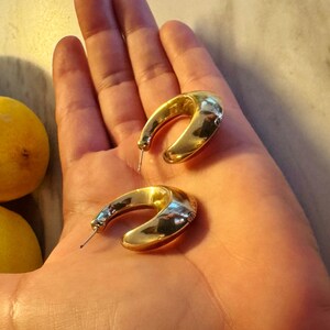 These vintage HALF HOOP EARRiNGS are FABULOUS!  They're gold vermeil over sterling.  The shape is a half hoop or crescent.  They're carinated and puffy or 3-d.  They're lightweight and wear beautifully.  I've left the original patina or tarnish.