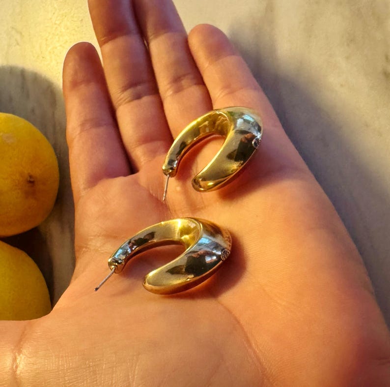 These vintage HALF HOOP EARRiNGS are FABULOUS!  They're gold vermeil over sterling.  The shape is a half hoop or crescent.  They're carinated and puffy or 3-d.  They're lightweight and wear beautifully.  I've left the original patina or tarnish.
