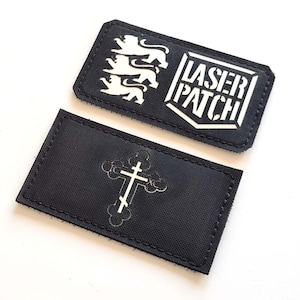 May include: Three black and white patches. One patch features three stylized lions and the text "LASER PATCH". The other patch has a white Orthodox cross design.