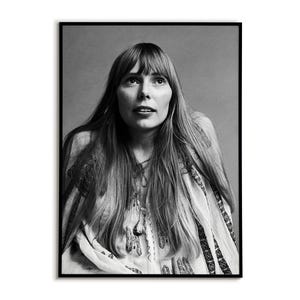 May include: Black and white portrait of a woman with long, straight hair and a patterned top. The framed photograph features a close-up of the woman looking upwards, with a neutral background. The image is a classic portrait style.