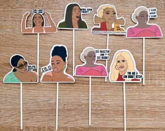 May include: Set of 8 printable cupcake toppers featuring colorful illustrations of women with humorous text. The text includes phrases like "The Lies!" and "So Nasty! And So Rude!"